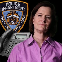 NYPD detective investigates Woman with dark hair in front of business telephone and an NYPD seal